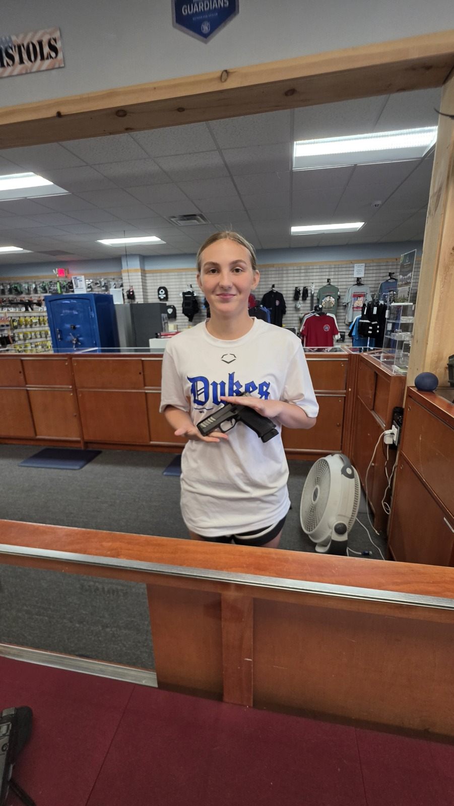 A staff member at the Frederick counter